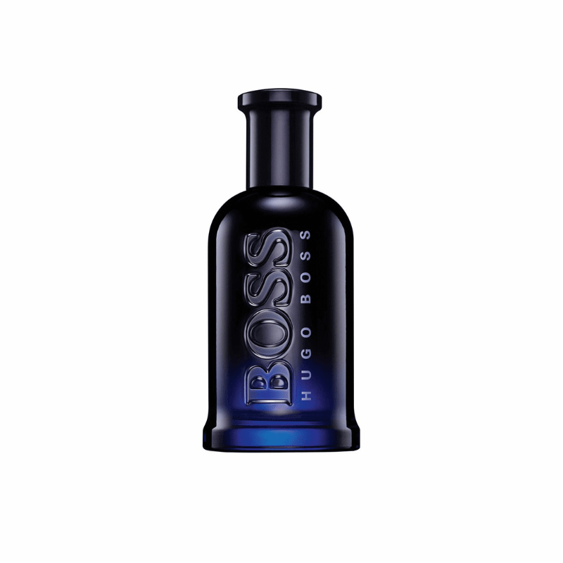 A full-shot image of a Boss Bottled Night Eau de Toilette bottle. The bottle is a dark, cylindrical glass with a blue gradient that deepens toward the bottom. The word BOSS is embossed vertically on the front in a glossy black finish, with HUGO BOSS printed in smaller letters underneath. The cap is a solid black cylinder. The bottle is set against a pure white background.
