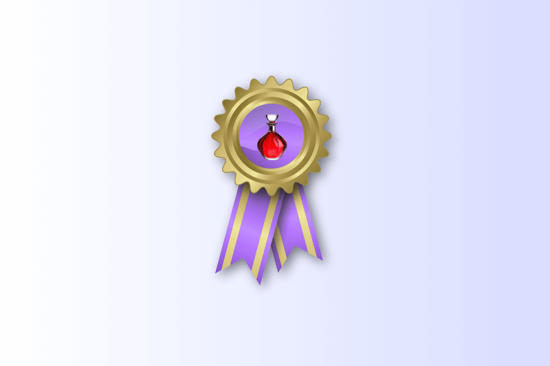 A gold award ribbon with a jagged edge and purple and yellow streamers, featuring a small, stylized red perfume bottle at its center.