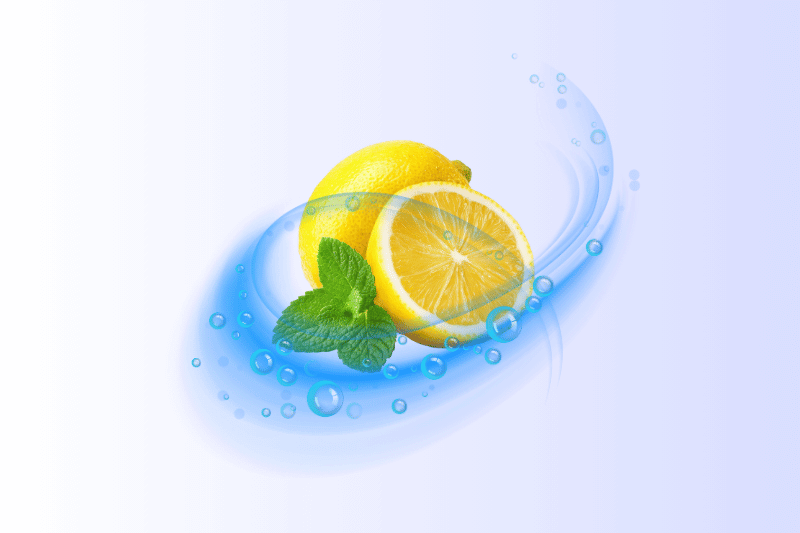 An illustration showing a whole lemon and a half-slice of lemon surrounded by a swirling blue water or fresh air effect, which also includes small water bubbles. A sprig of fresh mint is placed next to the lemon half. The background is a gradient of white to pale blue. The overall feeling is one of freshness and a clean, citrus scent.