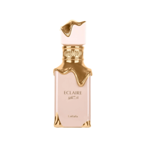 A single image of the Lattafa Eclaire Eau de Parfum bottle. The rectangular bottle is light pink/nude with gold metallic accents that resemble dripping icing or melted gold around the neck and cap, giving it a dessert-like, gourmand look. The word "ECLAIRE" is written in the centre.