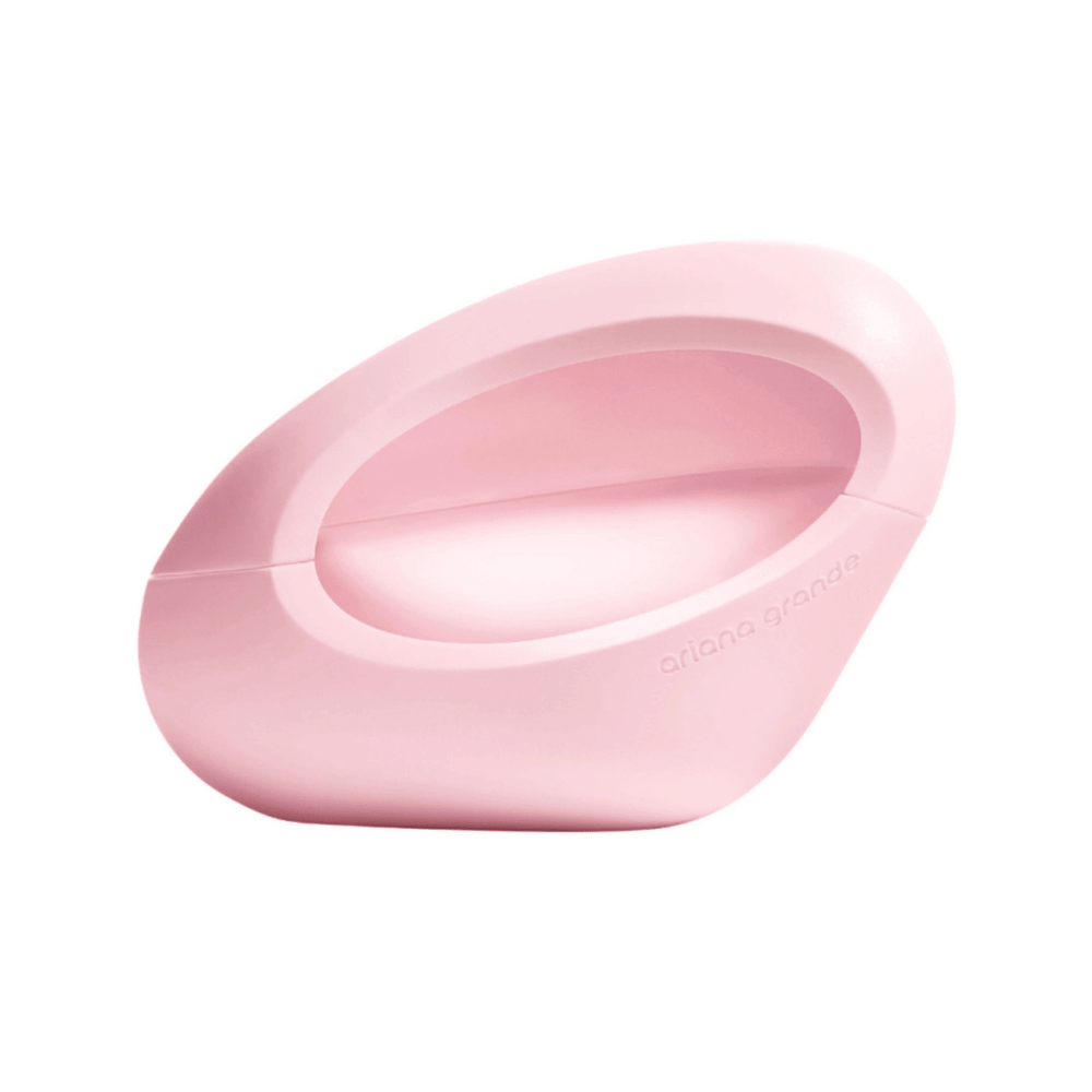 Ariana Grande Mod Blush Eau de Parfum bottle in its signature pink, sculptural oval-shaped design.